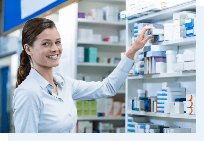 worker smiling in a pharmacy